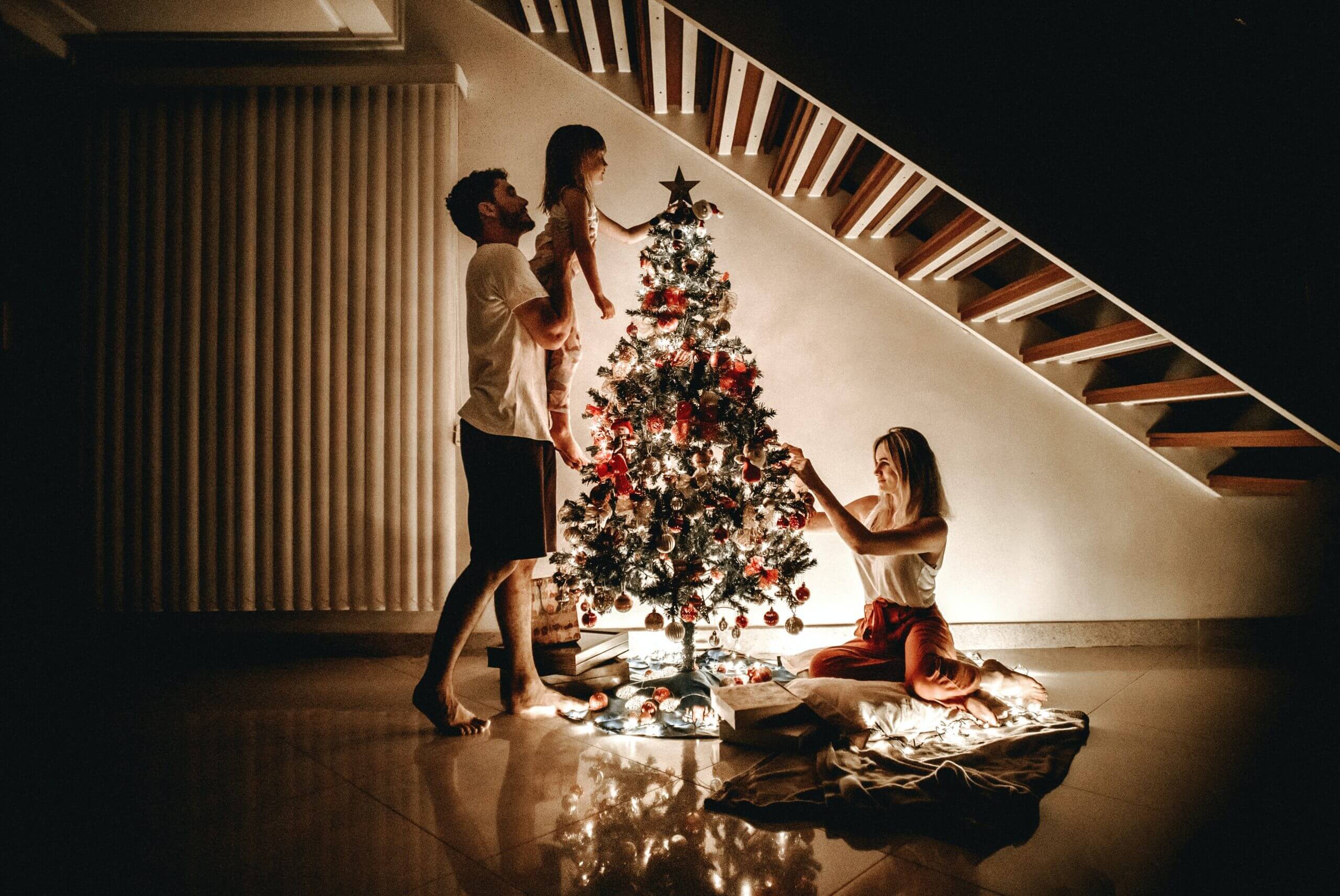 Family decorates Christmas tree